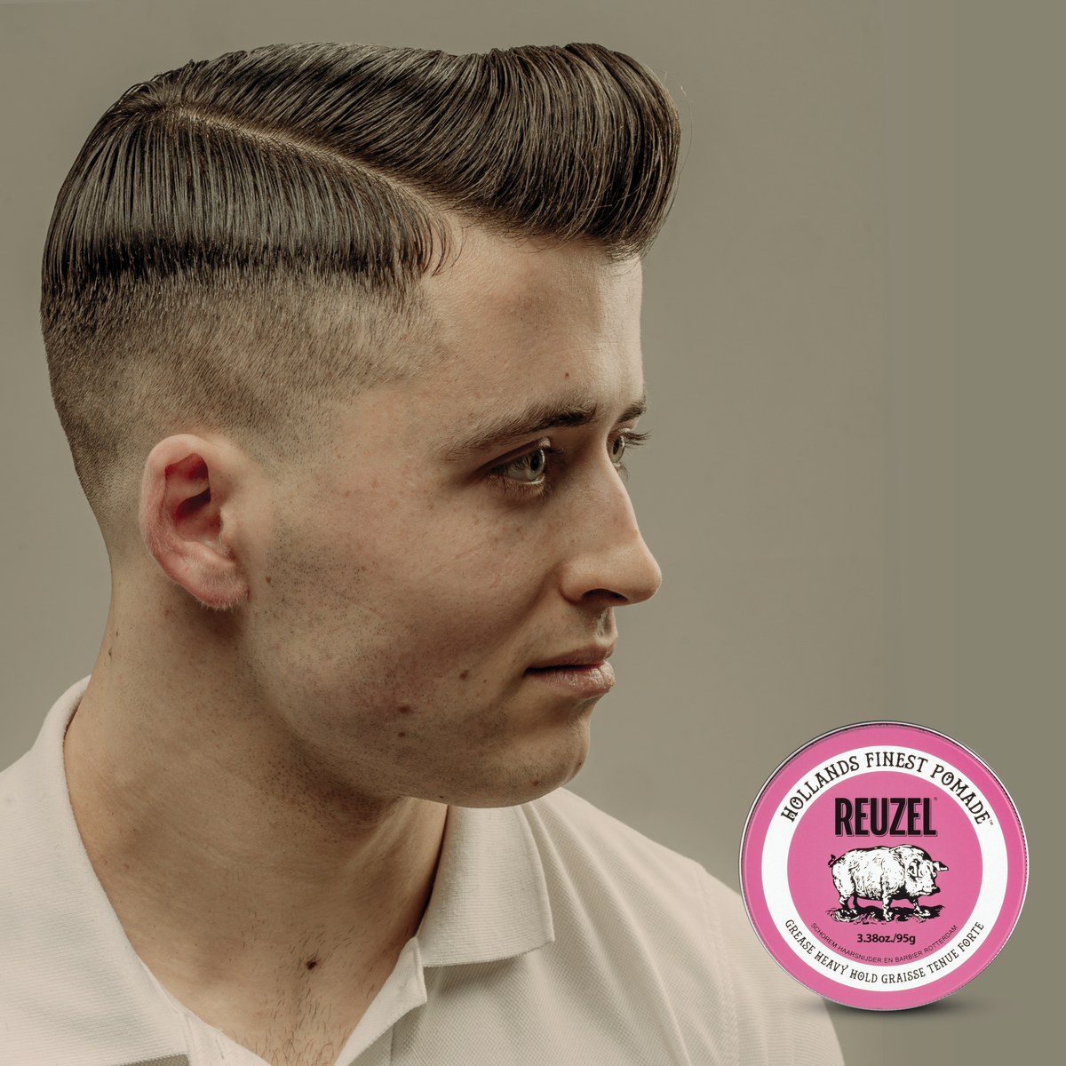 Reuzel Pink Pomade jar with pink label, showing the classic Reuzel Deutschland branding and product details.