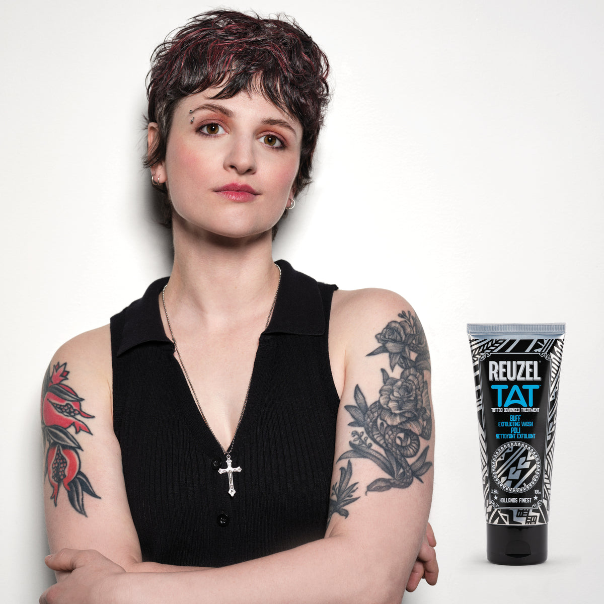 Reuzel Deutschland Buff Exfoliating Wash for tattoo aftercare, featuring a pump bottle with the product label visible.