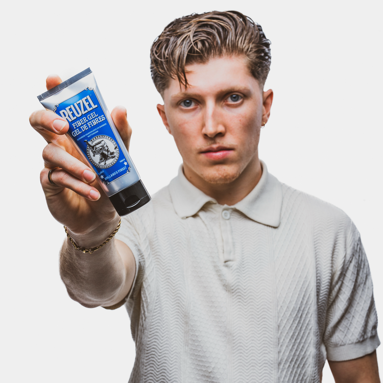 Reuzel Deutschland Fiber Gel hair styling product in a jar, showcasing its thick, fibrous gel texture for strong hold and styling.