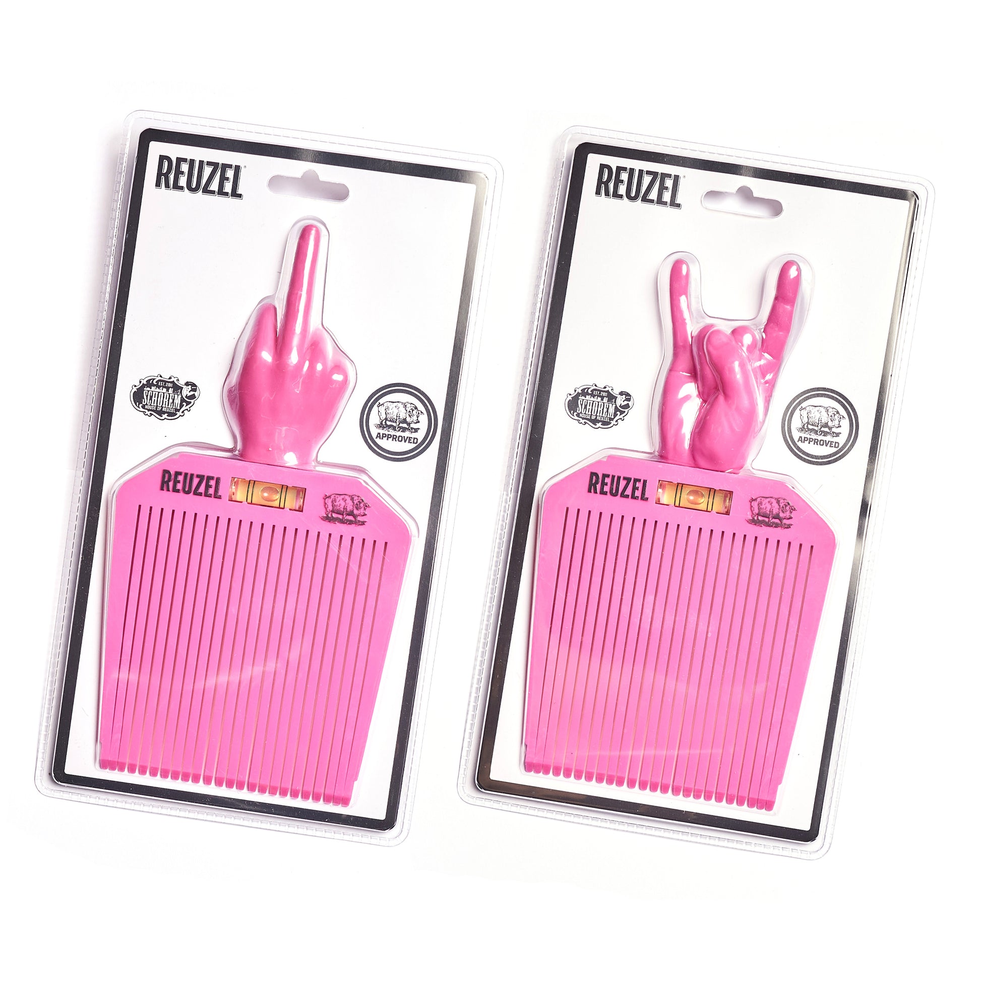Two pink Flat Top combs with hand gestures in their packaging, branded 'REUZEL' and 'SCHOREM'.