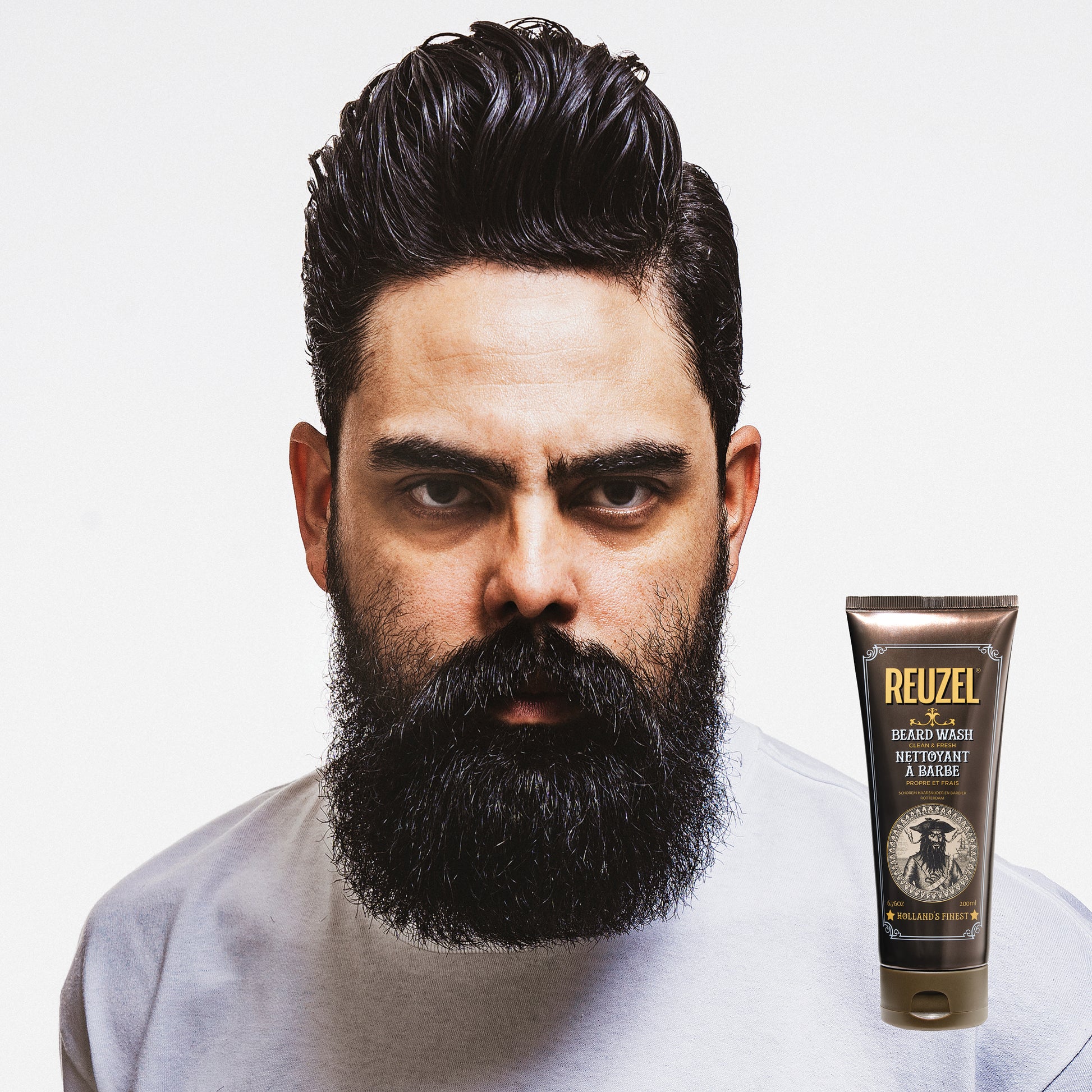 Reuzel Deutschland Clean & Fresh Beard Wash in a clear bottle with a pump dispenser, designed for beard cleansing and grooming.