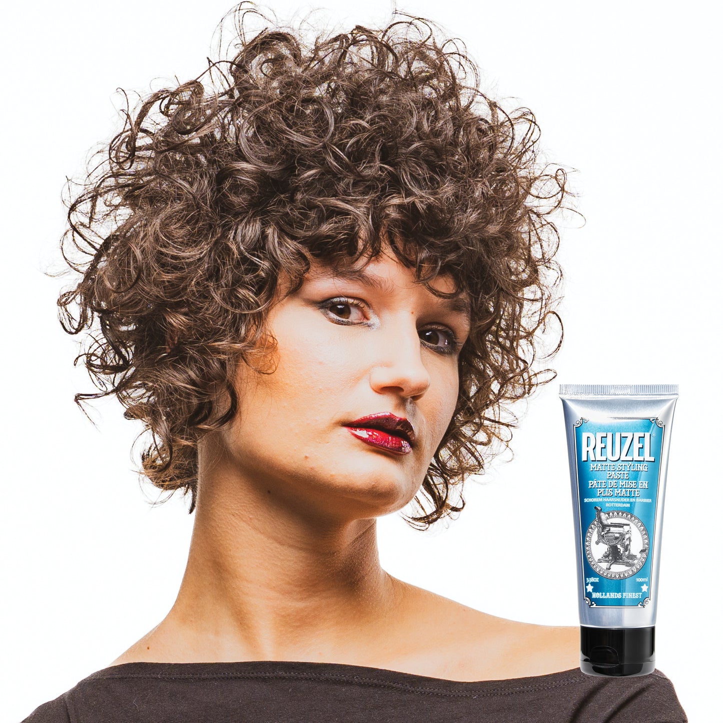 Woman with styled hair next to a Reuzel Matte Styling Paste on a white background