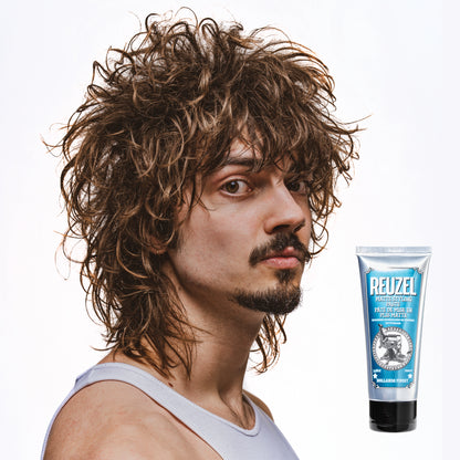 Man with styled hair next to a Reuzel Matte Styling Paste on a white background