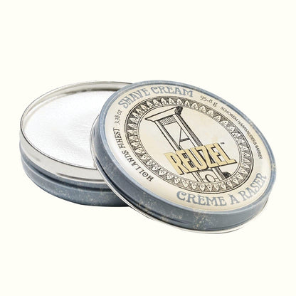 Reuzel shave cream tin with lid on a white background