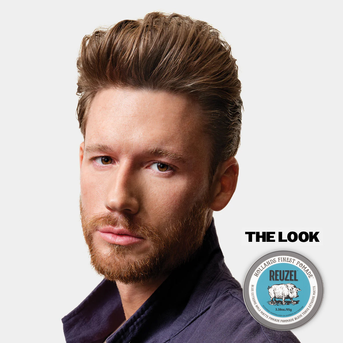 Man with styled hair and beard, featuring Reuzel Blue Extreme, on a light gray background