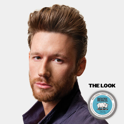 Man with styled hair and beard, featuring Reuzel Blue Extreme, on a light gray background