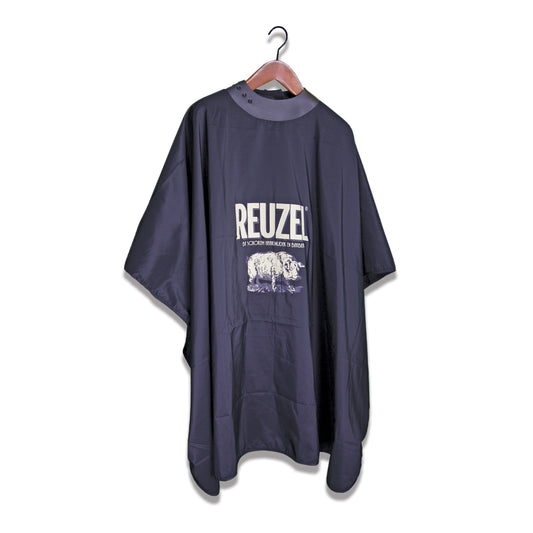 Black hairdressing cape with 'REUZEL' branding  against a white background
